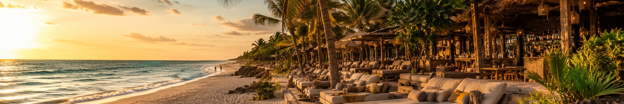 Beach club daybeds and palms on a Riviera Maya beach used to weigh Tulum and Playa del Carmen beach clubs