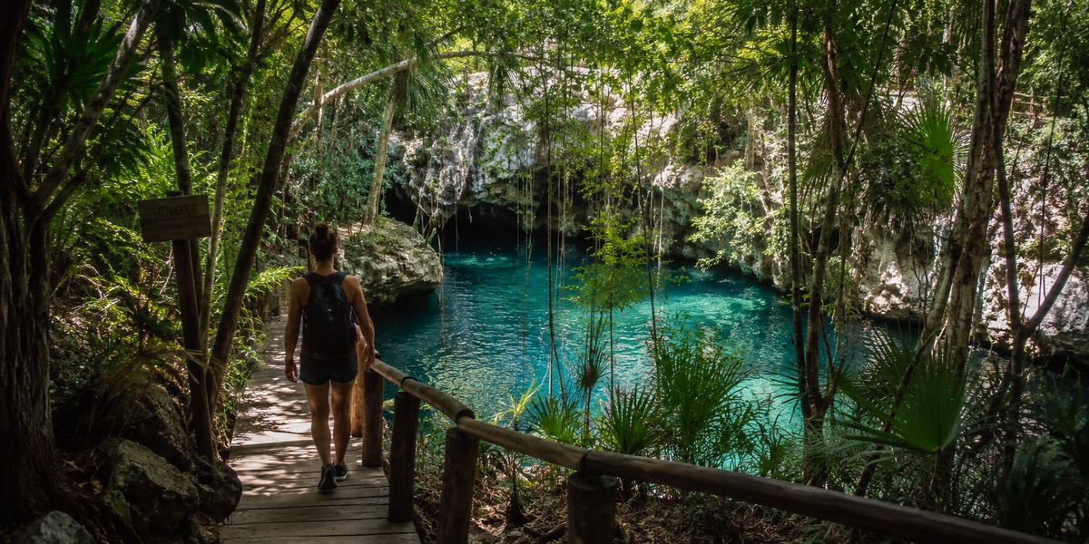 Riviera Maya all-inclusive resort set among palms with a calm beach and pool
