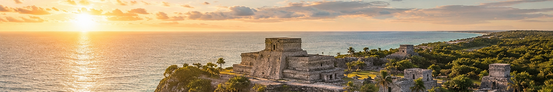 The Tulum ruins on a low cliff above turquoise Caribbean water, the setting that defines the visit